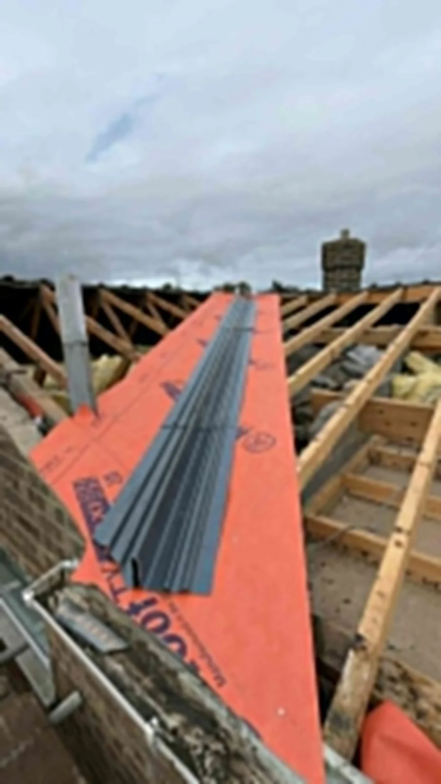 New roofing membrane being fitted along the ridge