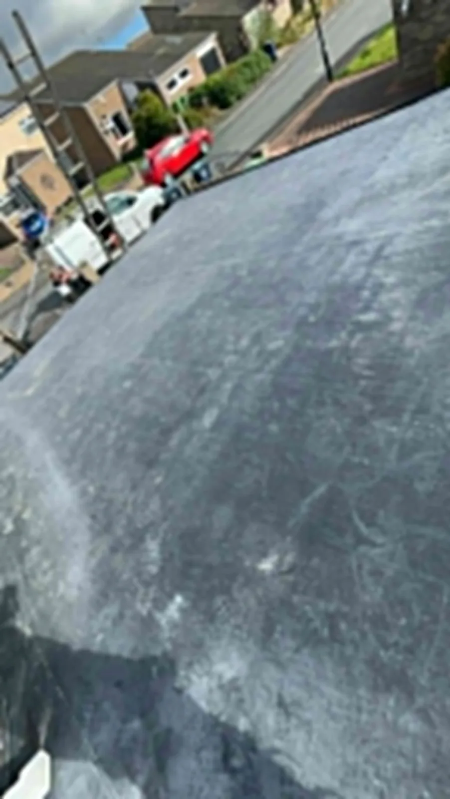 EPDM rubber flat roof overlooking a residential street