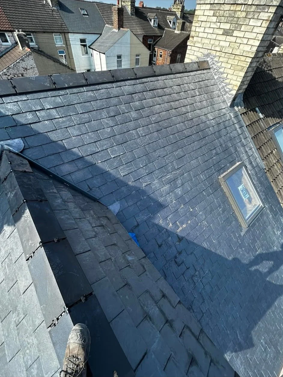 Slate roof, lead valley and rooflight viewed from above