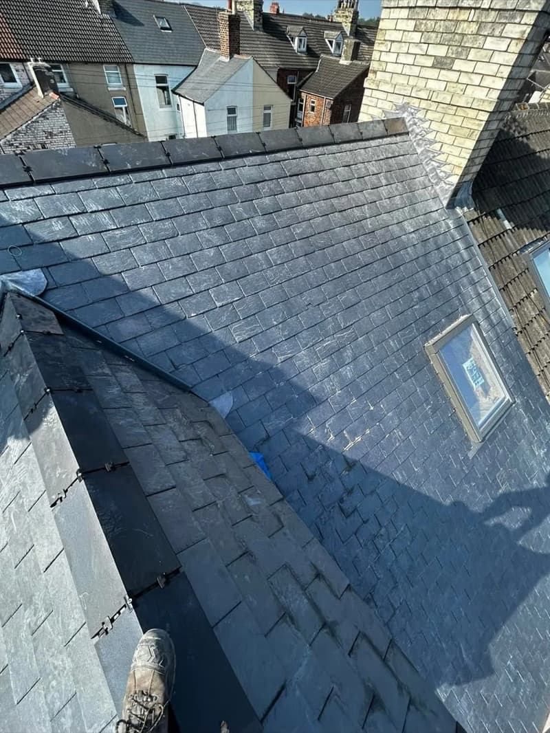 Slate roof, lead valley and rooflight viewed from above