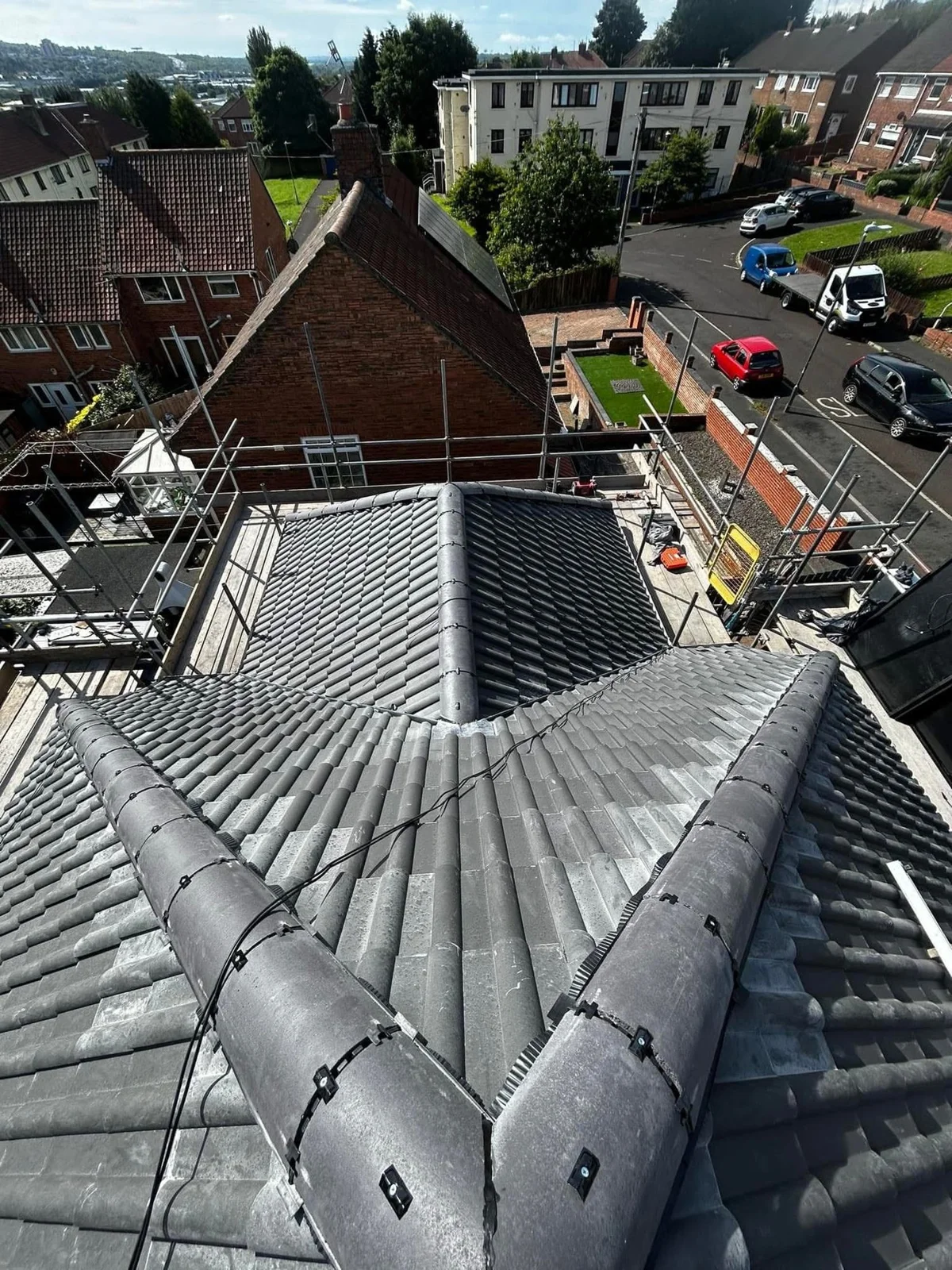 Finished grey tiled hipped roof