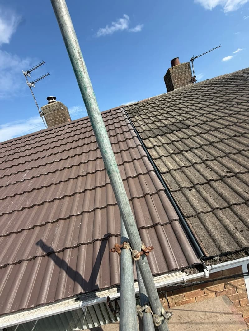 New brown roof tiles beside the neighbouring older tiles
