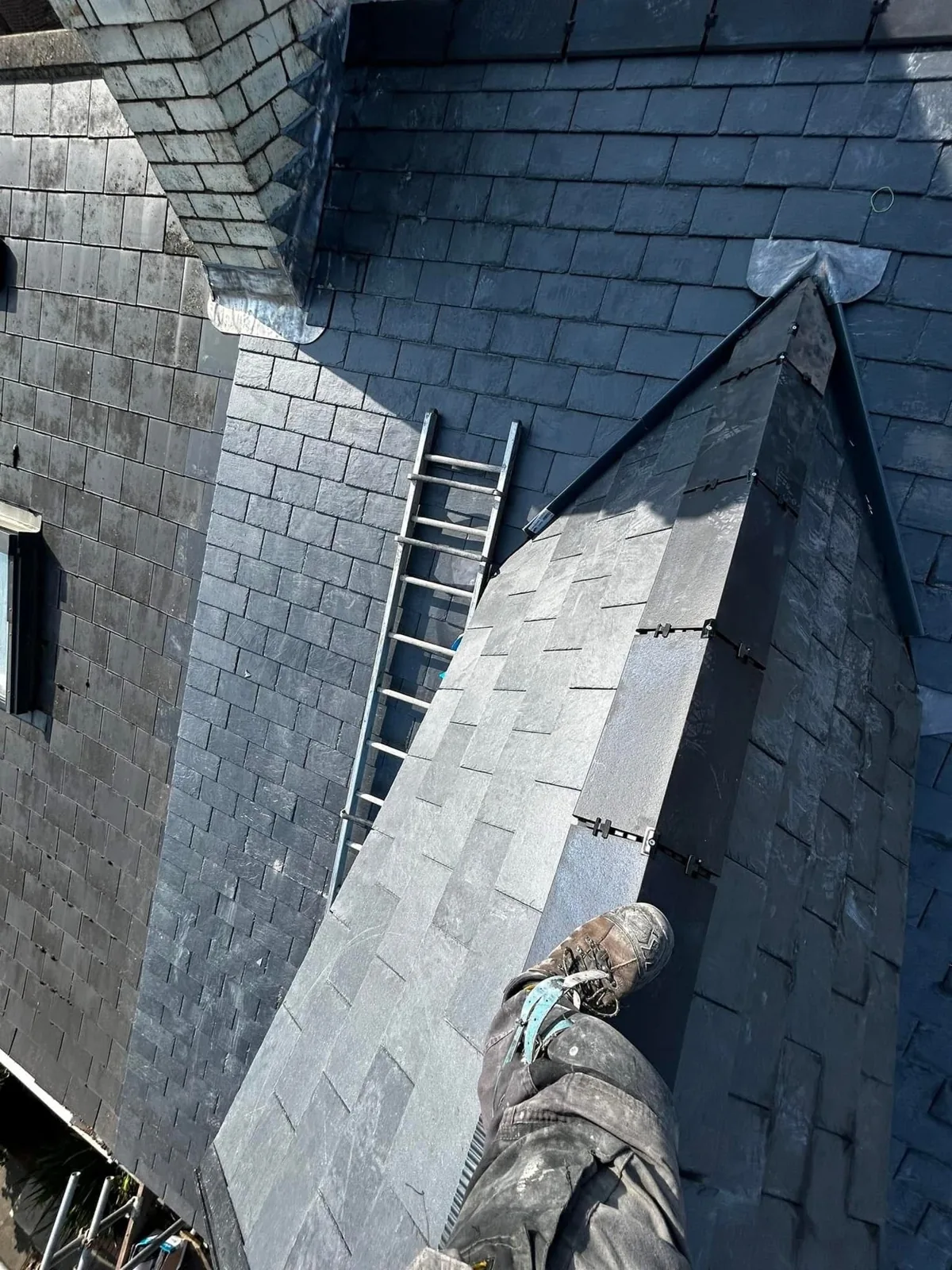 Slates around a dormer with lead detailing